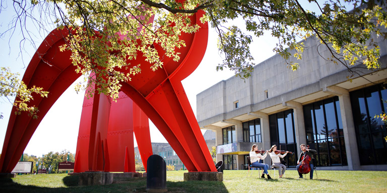 String trio performing outside of Musical Arts Center.